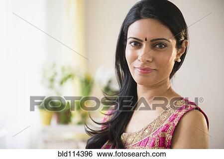 Stock Photograph - Indian woman wearing bindi and traditional garb. Fotosearch