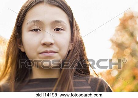 Japanese girl standing outdoors View Large Photo Image Stock Photo - Japanese girl standing outdoors. Fotosearch
