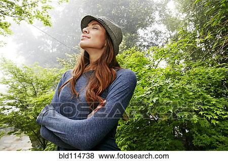 Middle Eastern woman breathing with eyes closed View Large Photo Image Stock Photo - Middle Eastern woman breathing with eyes closed. Fotosearch