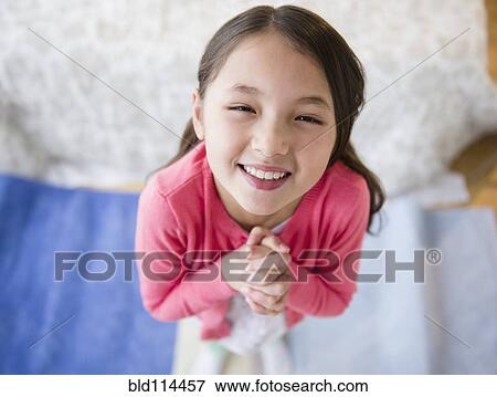 Stock Photo - Mixed race girl begging. Fotosearch