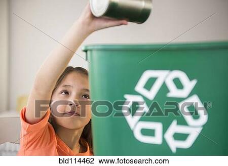Mixed race girl recycling can View Large Photo Image Stock Image - Mixed race girl recycling can. Fotosearch