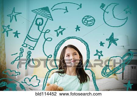 Mixed race girl with space doodles surrounding head View Large Photo Image Stock Image - Mixed race girl with space doodles surrounding head. Fotosearch