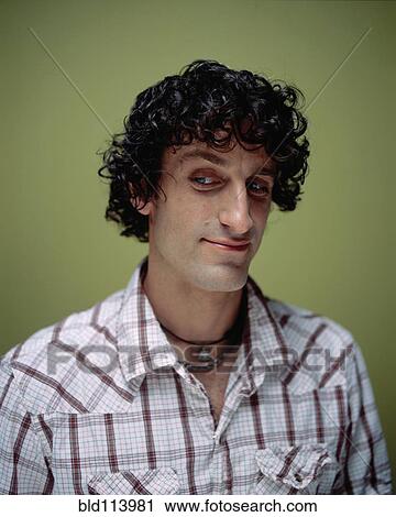 Mixed race man arching his eyebrow View Large Photo Image Stock Image - Mixed race man arching his eyebrow. Fotosearch
