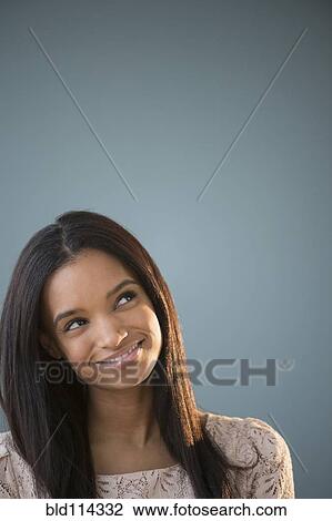 Stock Image - Mixed race woman smiling. Fotosearch