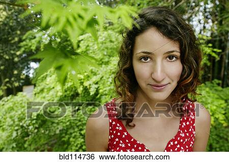 Mixed race woman standing outdoors View Large Photo Image Stock Photograph - Mixed race woman standing outdoors. Fotosearch