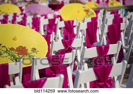 Parasols and silk scarves on chairs outdoors View Large Photo Image Stock Photo - Parasols and silk scarves on chairs outdoors. Fotosearch