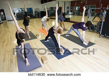 People practicing yoga in class View Large Photo Image Stock Image - People practicing yoga in class. Fotosearch
