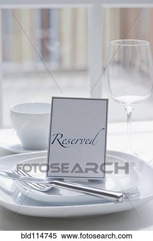 'Reserved' place setting at table View Large Photo Image Stock Photography - 'Reserved' place setting at table. Fotosearch