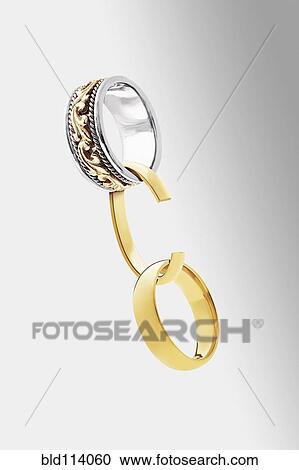 Stock Image - Rings with broken chain. Fotosearch
