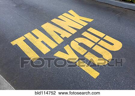 Stock Image - 'Thank you' painted on concrete. Fotosearch