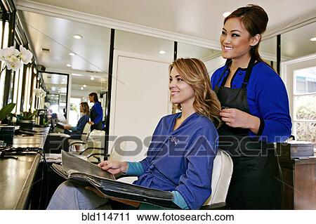 Woman having hair cut in salon View Large Photo Image Stock Image - Woman having hair cut in salon. Fotosearch