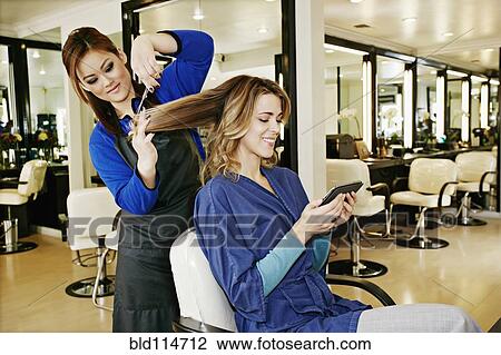 Woman having hair cut in salon View Large Photo Image Stock Image - Woman having hair cut in salon. Fotosearch