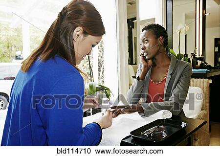 Woman having nails done in salon View Large Photo Image Stock Image - Woman having nails done in salon. Fotosearch