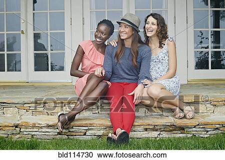 Women smiling together outdoors View Large Photo Image Stock Image - Women smiling together outdoors. Fotosearch