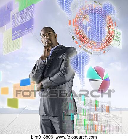 Stock Photograph - African American businessman examining illuminated holograms. Fotosearch