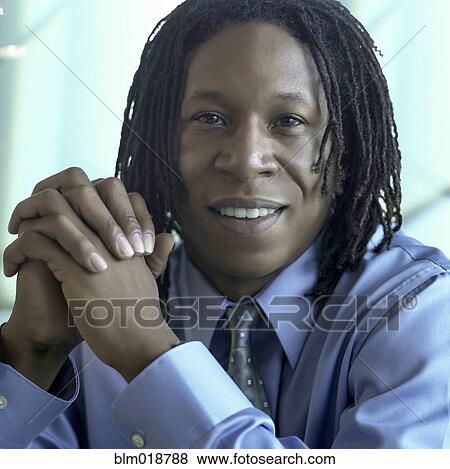 Stock Photo - African American businessman smiling. Fotosearch