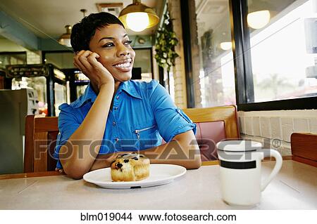 African American woman smiling in restaurant View Large Photo Image Picture - African American woman smiling in restaurant. Fotosearch