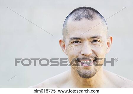 Stock Photography - Asian man smiling. Fotosearch