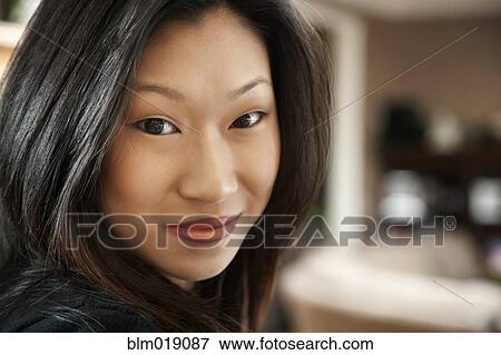 Stock Photo - Asian woman smiling. Fotosearch