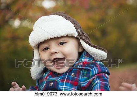 Stock Image - Baby smiling outdoors. Fotosearch