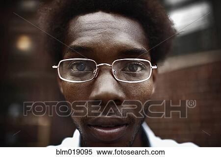 Black man wearing eyeglasses View Large Photo Image Stock Photography - Black man wearing eyeglasses. Fotosearch