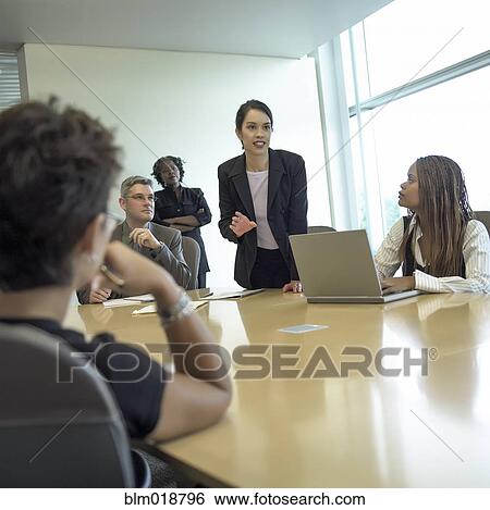 Businesswoman talking in meeting View Large Photo Image Stock Photograph - Businesswoman talking in meeting. Fotosearch