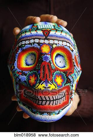 Caucasian hand holding colorful beaded skull View Large Photo Image Stock Photo - Caucasian hand holding colorful beaded skull. Fotosearch