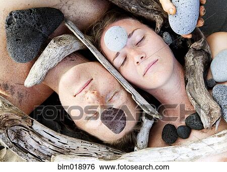 Caucasian women surrounded by wood and rocks View Large Photo Image Stock Photograph - Caucasian women surrounded by wood and rocks. Fotosearch