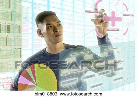 Chinese man using illuminated touch screen View Large Photo Image Stock Image - Chinese man using illuminated touch screen. Fotosearch