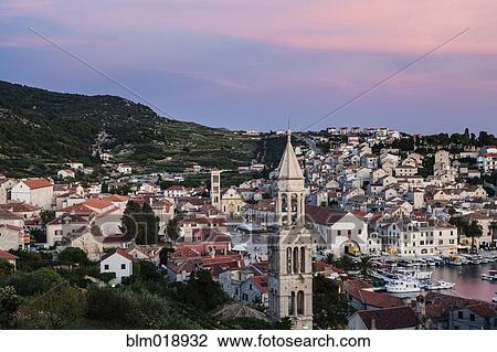 Stock Image - City skyline at dusk, Hvar Island, Croatia. Fotosearch