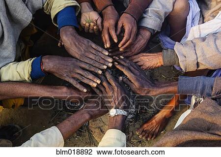 Stock Image - Close up of hands in circle at festival, Allahabad, Uttar Pradesh, India. Fotosearch