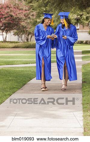 College graduates walking on campus View Large Photo Image Stock Image - College graduates walking on campus. Fotosearch
