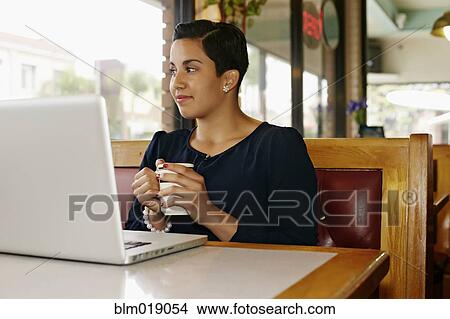Hispanic businesswoman working in restaurant View Large Photo Image Picture - Hispanic businesswoman working in restaurant. Fotosearch