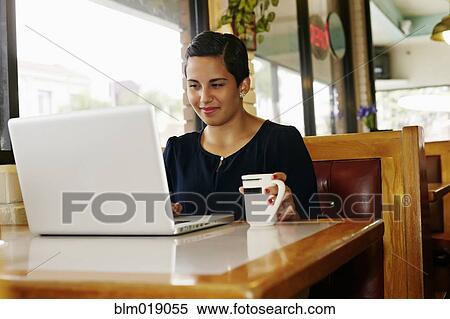 Hispanic businesswoman working in restaurant View Large Photo Image Stock Photography - Hispanic businesswoman working in restaurant. Fotosearch