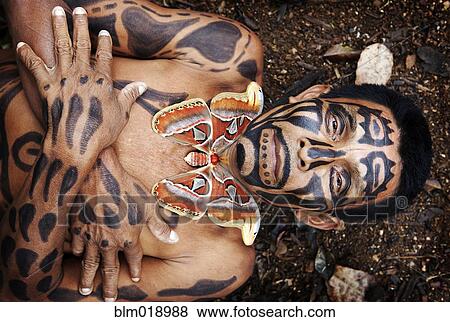 Hispanic man with painted body laying in dirt, Lago Izabal, Guatemala View Large Photo Image Stock Photo - Hispanic man with painted body laying in dirt, Lago Izabal, Guatemala. Fotosearch