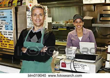 Hispanic servers smiling in restaurant View Large Photo Image Stock Image - Hispanic servers smiling in restaurant. Fotosearch