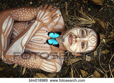 Hispanic woman with painted body laying in dirt, Lago Izabal, Guatemala View Large Photo Image Stock Photo - Hispanic woman with painted body laying in dirt, Lago Izabal, Guatemala. Fotosearch