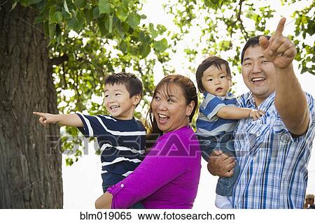 Stock Photography - Japanese family playing in park. Fotosearch