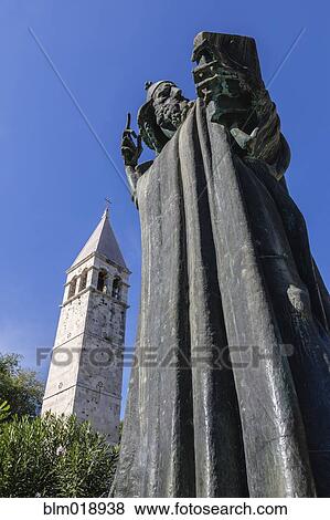 Stock Photo - Low angle view of statue with book, Split, Dalmatia, Croatia. Fotosearch