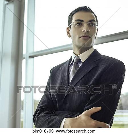 Middle Eastern businessman with arms crossed View Large Photo Image Stock Image - Middle Eastern businessman with arms crossed. Fotosearch