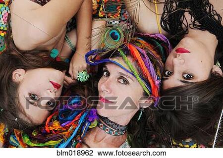 Mother and daughters wearing colorful jewelry View Large Photo Image Stock Image - Mother and daughters wearing colorful jewelry. Fotosearch