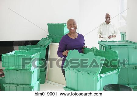 Older Black couple unpacking in new home View Large Photo Image Stock Image - Older Black couple unpacking in new home. Fotosearch