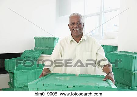 Older Black man smiling in new home View Large Photo Image Stock Photography - Older Black man smiling in new home. Fotosearch