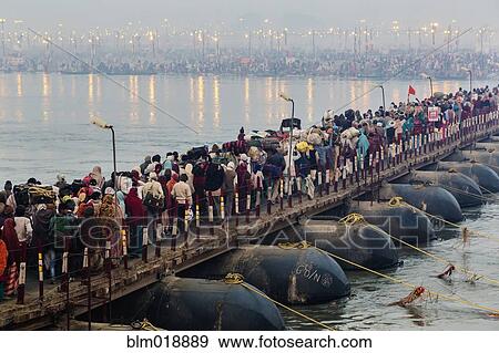Stock Photo - People on bridge over river, Allahabad, Uttar Pradesh, India. Fotosearch