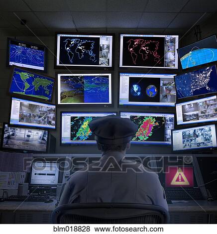 Police officer working in control room View Large Photo Image Stock Photo - Police officer working in control room. Fotosearch