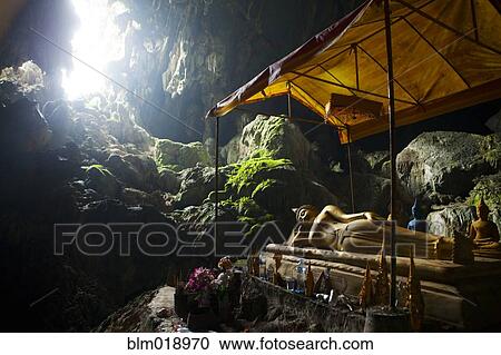 Religious statue in rocky cave, Luang Prabang, Luang Prabang, Laos View Large Photo Image Stock Image - Religious statue in rocky cave, Luang Prabang, Luang Prabang, Laos. Fotosearch
