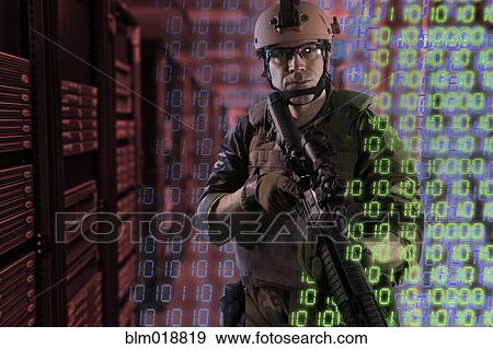 Soldier holding gun in server room View Large Photo Image Stock Photo - Soldier holding gun in server room. Fotosearch