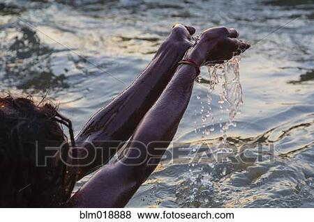 Woman bathing in water, Allahabad, Uttar Pradesh, India View Large Photo Image Stock Photo - Woman bathing in water, Allahabad, Uttar Pradesh, India. Fotosearch