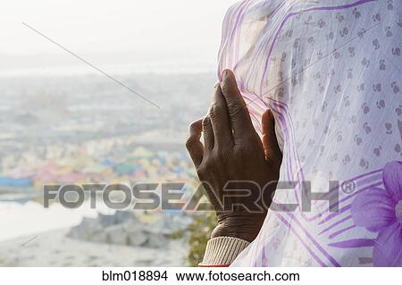 Picture - Woman wearing headscarf outdoors. Fotosearch
