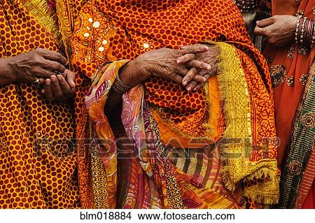 Picture - Women wearing traditional Indian clothing at festival, Allahbad, Uttar Pradesh, India. Fotosearch